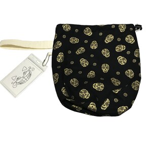 May include: Black drawstring bag with a gold sugar skull pattern. The bag has a white strap and a clear plastic tag with a black and white illustration of a smiling face.