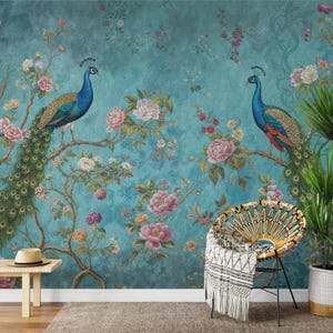 May include: A teal blue wallpaper with a floral pattern featuring peacocks. The wallpaper has a vintage feel and is perfect for a living room or bedroom.