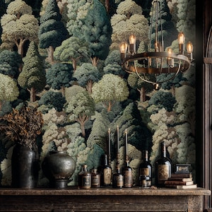 May include: A room featuring a forest-themed wallpaper with various shades of green and brown. A dark metal chandelier hangs from the ceiling. A wooden shelf displays vases, bottles, candles, and books, creating a rustic ambiance.