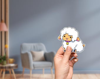 May include: A white cartoon sheep with a pink collar and a gold bell. The sheep has a happy expression and is holding its head up.