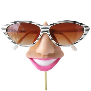 Smiling eyeglass holder, nose sunglasses display,  eyewear display stand