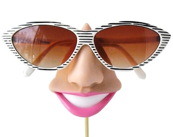 Smiling eyeglass holder, nose sunglasses display,  eyewear display stand