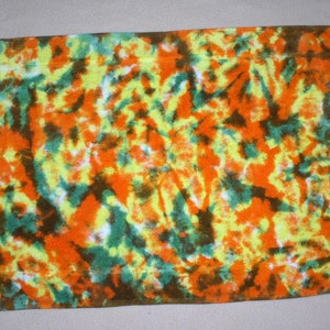 Bath mat, tie dyed, orange, yellow, green, and brown. Crinkle pattern  BM 121620.1