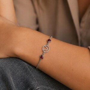 Swinger bracelet with symbol & ruby red hearts | Adjustable stainless steel bracelet | Handmade gift