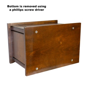 May include: A wooden box with a removable bottom. The bottom is secured with four screws. The box is made of dark brown wood.