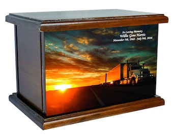 May include: A wooden cremation urn with a sunset and semi-truck image. The urn has a personalized inscription that reads "In Loving Memory Willie Gene Harris November 7th, 1968 - July 9th, 2016".