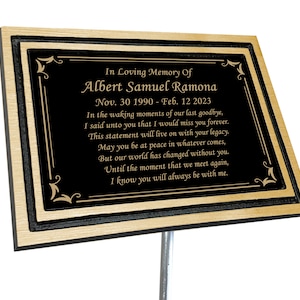 May include: A black and gold memorial plaque with a poem inscribed in gold lettering. The plaque reads "In Loving Memory Of Albert Samuel Ramona Nov. 30 1990 - Feb. 12 2023 In the waking moments of our last goodbye, I said unto you that I would miss you forever. This statement will live on with your legacy. May you be at peace in whatever comes, But our world has changed without you. Until the moment that we meet again, I know you will always be with me."