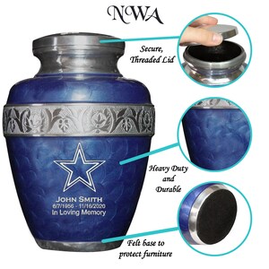May include: Blue and silver metal cremation urn with a star design and the inscription "JOHN SMITH 6/7/1956 - 11/16/2020 In Loving Memory". The urn has a threaded lid and a felt base to protect furniture.