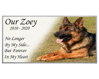 May include: A memorial plaque with a photo of a German Shepherd dog. The plaque reads "Our Zoey 2010-2020 No Longer By My Side... But Forever In My Heart"