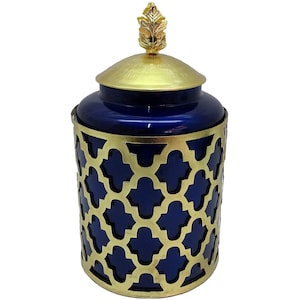 May include: A blue ceramic jar with a gold lid and a gold decorative cage. The lid has a gold leaf finial.