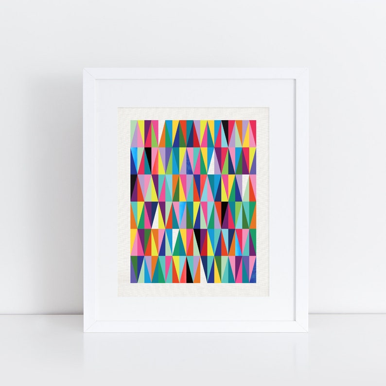 May include: A framed print featuring a geometric pattern of colourful triangles in shades of red, orange, yellow, green, blue, purple, pink and black.