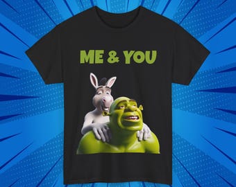 May include: Black t-shirt with a green ogre and a donkey character from the movie Shrek. The text "ME & YOU" is printed in white on the shirt.