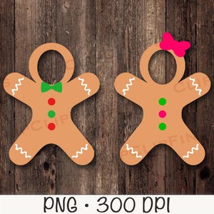 May include: Two gingerbread person cut-outs with blank faces for inserting photos. The gingerbread people are brown with white icing details and red and green candy decorations.