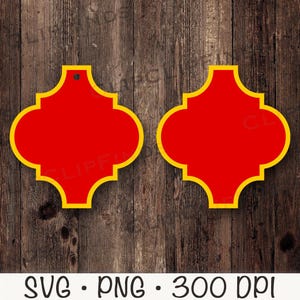May include: Two red, quatrefoil-shaped designs with a yellow border. The designs have a small hole at the top. The bottom of the image has the text "SVG • PNG • 300 DPI". The background is a wooden surface.