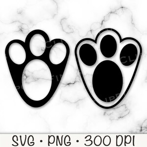 May include: Two black paw prints, one with a filled-in center and one with an empty center.