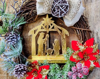 Nativity Manger Christmas Wreath: Gold Scene, Snowy Pine, Poinsettias