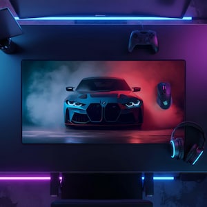 May include: A rectangular desk mat featuring a front-facing BMW car graphic surrounded by blue and red smoke. The mat is placed on a dark desk with a gaming controller, a computer mouse, and headphones nearby, all illuminated by blue and purple ambient lighting.