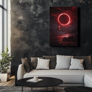 May include: A canvas art print depicting a surreal landscape with a red glowing ring in the sky. The artwork features a dark, moody color palette with shades of red, black, and gray. The print is displayed above a modern sofa.