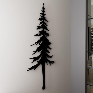 Peut inclure: Silhouette noire d'un pin sur un mur blanc. L'arbre est une décoration murale.