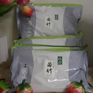 May include: Two rectangular silver and white pouches of Marukyu Koyamaen Wakatake matcha powder. Each pouch features a white label with black Japanese characters and the text Wakatake. The packaging has green accents and branding.