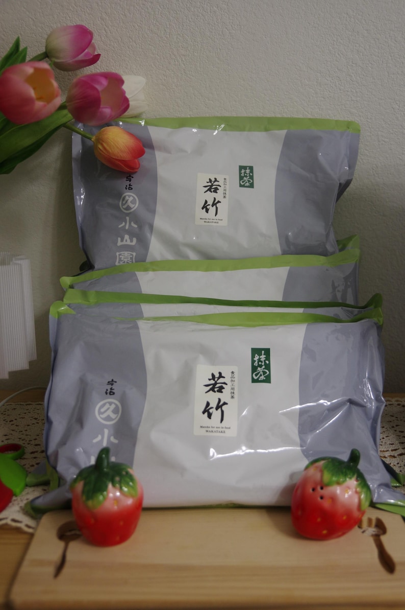 May include: Two rectangular silver and white pouches of Marukyu Koyamaen Wakatake matcha powder. Each pouch features a white label with black Japanese characters and the text Wakatake. The packaging has green accents and branding.