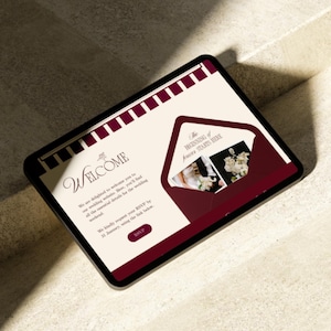May include: A digital tablet displaying a wedding website design. The design features a burgundy and cream color scheme with the word "WELCOME" in elegant script. An envelope graphic contains photos and the text "The Beginning of Forever Starts Here."