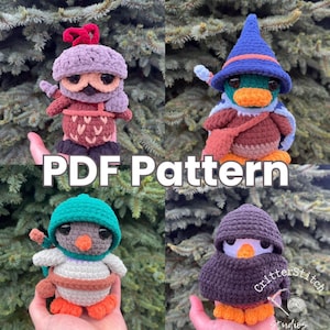 May include: Crochet pattern PDF for four amigurumi duck plushies. The ducks are wearing different hats and outfits, including a purple and red knight, a blue wizard, a green ninja, and a black hooded figure. The pattern is available for download.