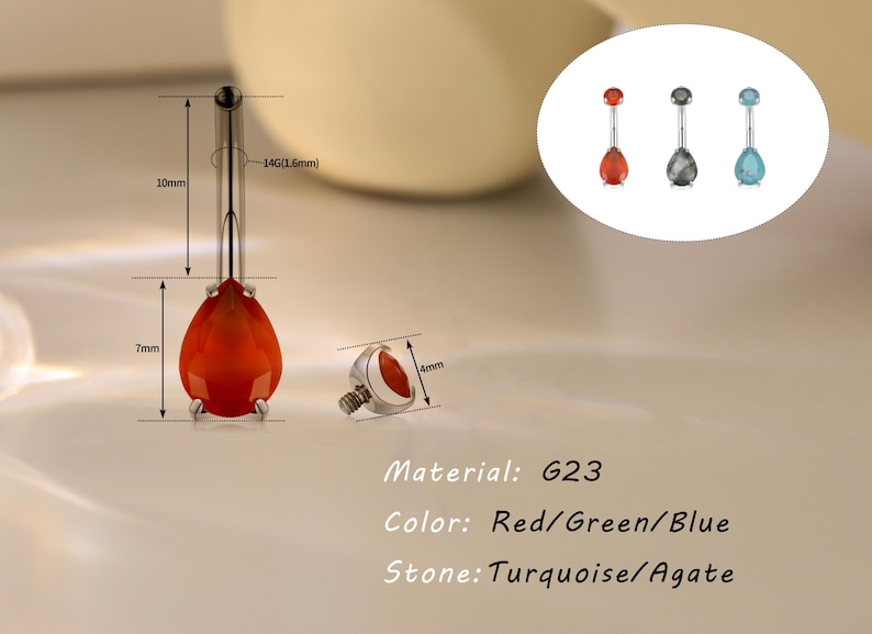 May include: A body piercing jewelry piece with a teardrop-shaped red stone, measuring 7mm in length, and a 10mm long post. The jewelry is made of G23 material and is available in red, green, and blue stone colors. The stone options are turquoise and agate.