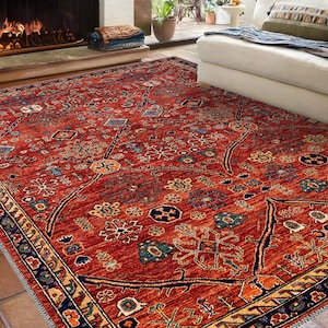 May include: A red, blue and gold patterned rug with a geometric design. The rug has a dark blue border with a gold and white pattern.