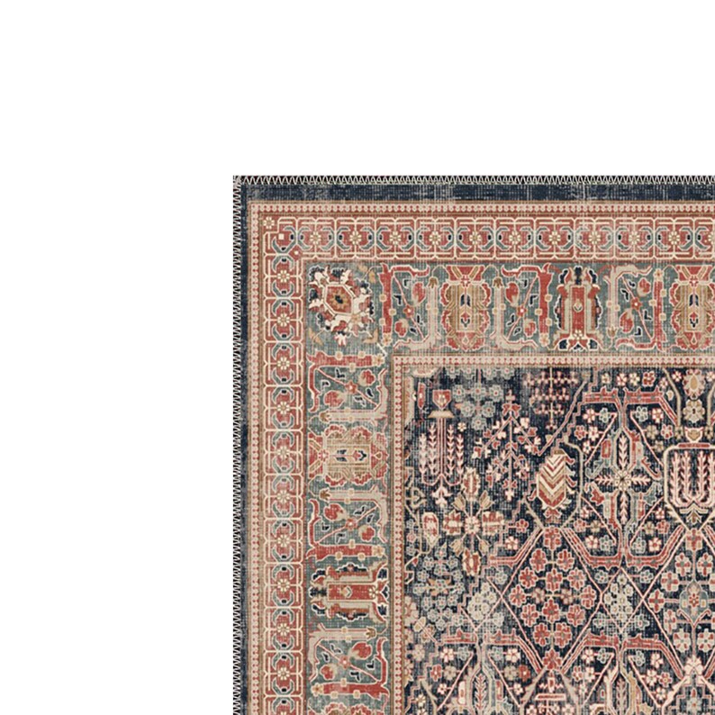 May include: Close-up of a section of an area rug with an intricate, traditional design. The rug features a navy blue central field with a detailed pattern in shades of red, beige, and teal. A border frames the design.