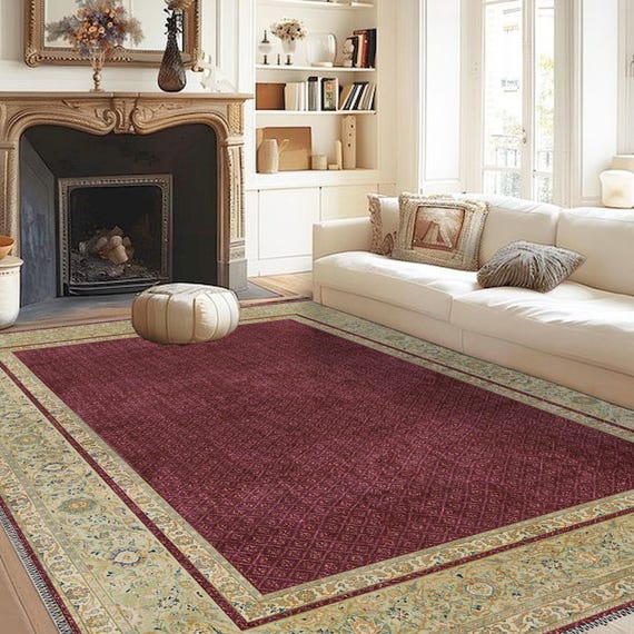 Red area rug with gold borders, a striking red rug for luxurious settings