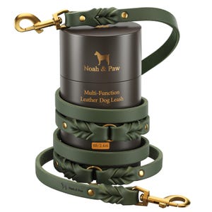 May include: A dark olive green leather dog leash wrapped around a cylindrical brown container. The container features the text Noah & Paw, Multi-Function Leather Dog Leash, and 8ft/2.4m. The leash has gold-toned metal hardware and braided details.