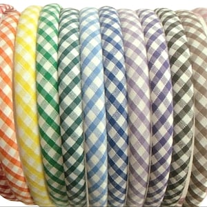 May include: A set of 12 gingham hair bands in various colors, including red, orange, yellow, green, blue, purple, brown, and pink.