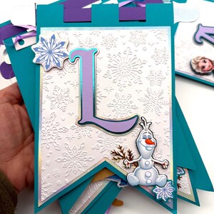 May include: A white ceramic mug with a black handle and the text "But First, Coffee" in a bold, black font. The mug is set against a neutral background, highlighting its simple design.