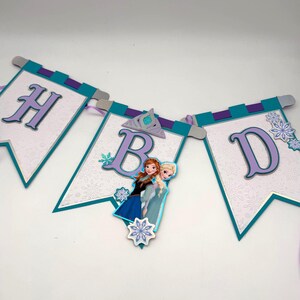 May include: A white ceramic mug with a black handle and the text "But First, Coffee" in a black, bold font. The mug is on a white surface.