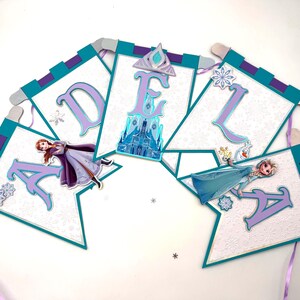 May include: A white ceramic mug with a black handle and the text "But First, Coffee" in a black, handwritten-style font. The mug is on a white surface.