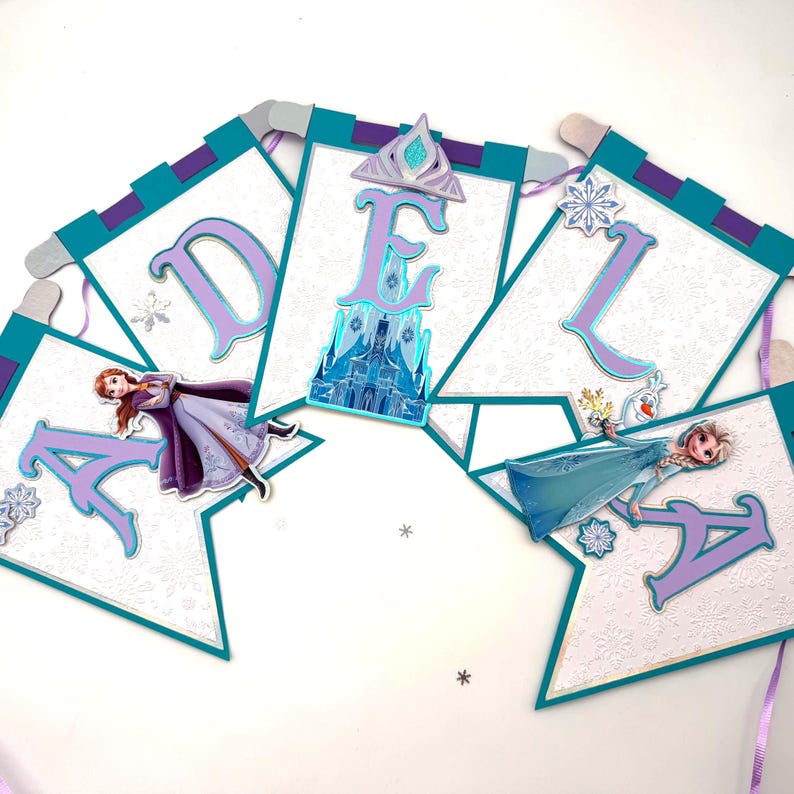 May include: A white ceramic mug with a black handle and the text "But First, Coffee" in a black, handwritten-style font. The mug is on a white surface.