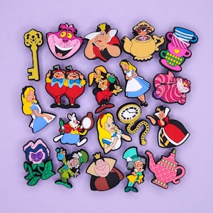 May include: A collection of colorful, cartoon-style charms featuring characters and objects from Alice in Wonderland. Includes Alice, the Cheshire Cat, the Queen of Hearts, a key, and a pocket watch.