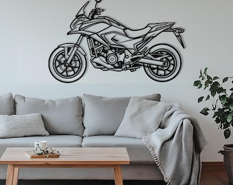 May include: A black metal wall art piece shaped like a motorcycle in profile. The design features a detailed outline of a sport touring motorcycle, including the wheels, engine, frame, seat, handlebars, and windshield, rendered in a flat silhouette.