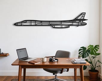 May include: A black metal wall art piece shaped like the silhouette of a supersonic aircraft. The design features a hollow, linear frame that outlines the fuselage, wings, and tail section of the plane, mounted horizontally on a plain wall.