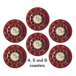 May include: Six red coasters with a vintage rotary phone dial design. Each coaster features a white dial with black numbers and a small white label with the text "919 364-2828". The coasters are labeled with the letters "ABC", "DEF", "GHI", "JKL", "MNO", "PRS", "TUV", "WXY", and "0".