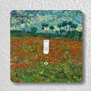 May include: A light switch cover featuring a painting of a field of red poppies with a blue sky and green trees in the background.