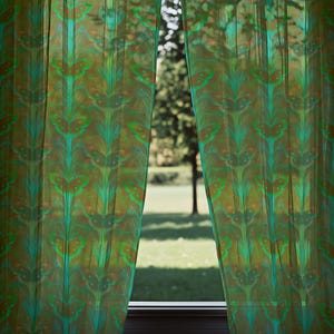 Sheer curtain panel featuring an intricate pattern of luminous emerald green Luna moths on an amber background. The design shows symmetrical rows of moths with delicate wing details and botanical elements in a vertical arrangement.