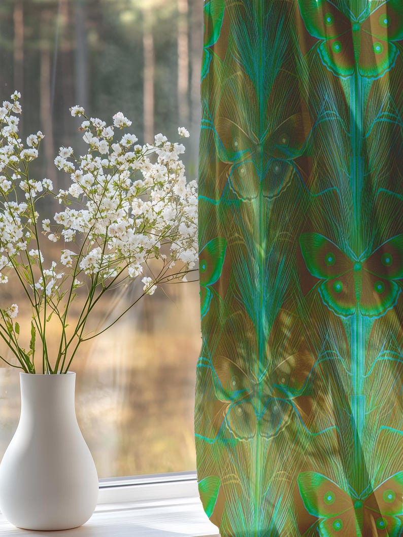 Sheer curtain panel featuring an intricate pattern of luminous emerald green Luna moths on an amber background. The design shows symmetrical rows of moths with delicate wing details and botanical elements in a vertical arrangement.