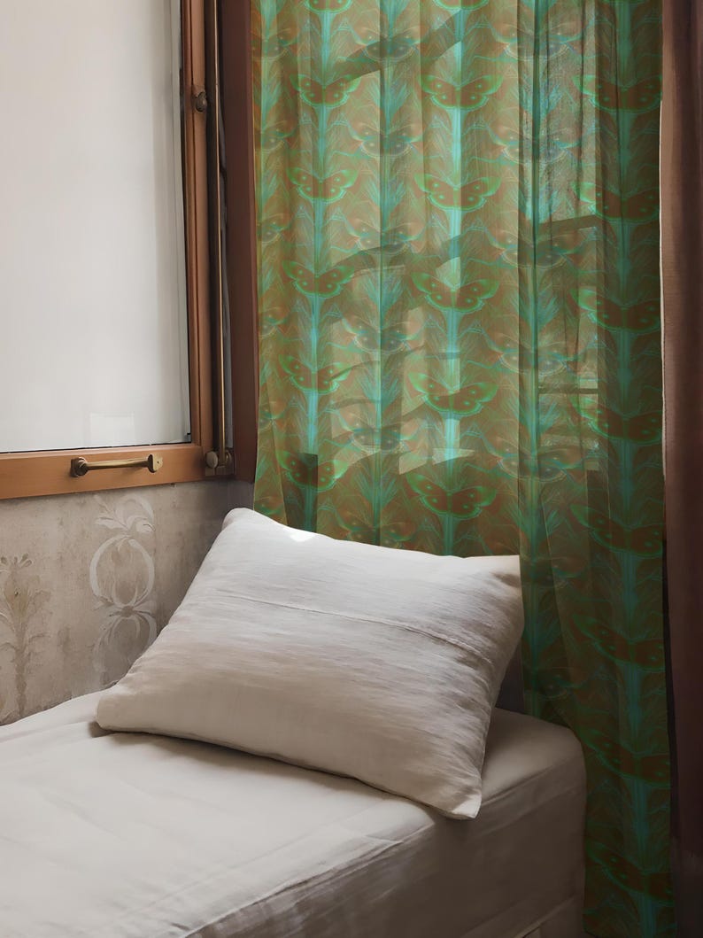 Sheer curtain panel featuring an intricate pattern of luminous emerald green Luna moths on an amber background. The design shows symmetrical rows of moths with delicate wing details and botanical elements in a vertical arrangement.