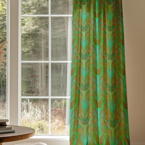 Sheer curtain panel featuring an intricate pattern of luminous emerald green Luna moths on an amber background. The design shows symmetrical rows of moths with delicate wing details and botanical elements in a vertical arrangement.