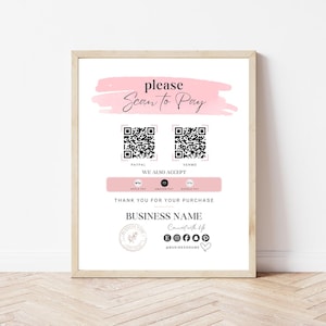May include: A printable sign with a pink watercolor background that says "please scan to pay". It features two QR codes, one for PayPal and one for Venmo. The sign also lists other payment methods including Apple Pay, Amazon Pay, and Google Pay. The sign says "Thank you for your purchase" and includes the business name, social media icons, and the business's Instagram handle.