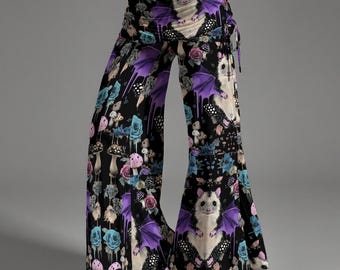 May include: Wide-leg pants featuring a black base with a repeating pattern of white opossums with purple bat wings, blue roses, and various mushrooms. The pants have a fold-over waistband and a drawstring tie detail on the side of the hip.