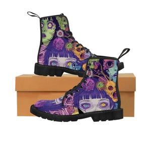May include: Black leather boots with a colourful print of faces and flowers. The print features a variety of colours, including purple, green, yellow, and blue.
