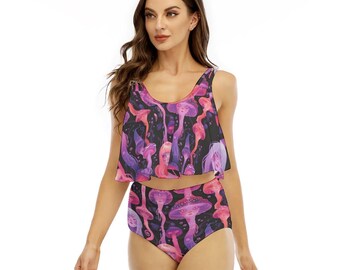 May include: A two-piece swimsuit featuring a black base with a repeating pattern of pink and purple mushrooms and stylized faces. The top is a sleeveless crop style with a ruffled hem, and the bottom is a high-waisted brief style.